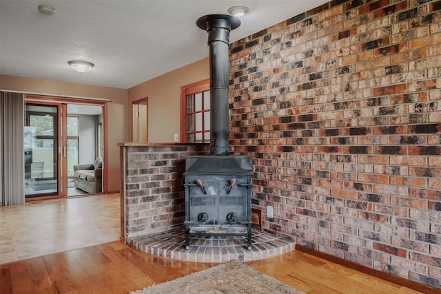 20541 E 2050 N Rd, Towanda, IL 61776 - detailed view of a wood stove, wood finished floors, and a smoke detector