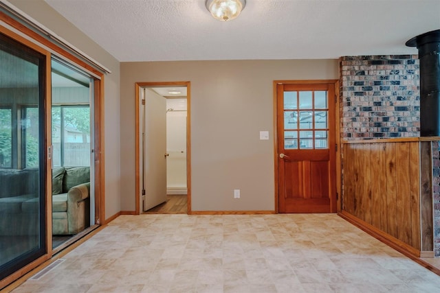 20541 E 2050 N Rd, Towanda, IL 61776 - doorway to outside featuring baseboards, a textured ceiling, and light floors