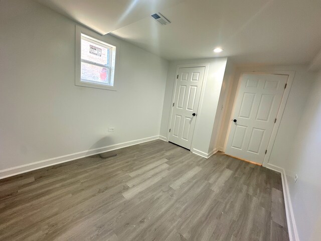 15117 2nd Ave, Phoenix, IL 60426 - unfurnished bedroom with baseboards, wood finished floors, and recessed lighting