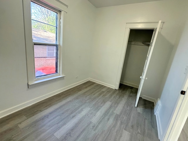 15117 2nd Ave, Phoenix, IL 60426 - unfurnished bedroom featuring wood finished floors, baseboards, and a closet