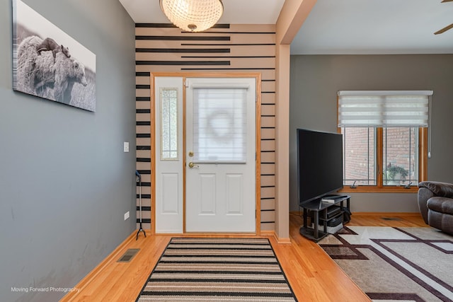 608 W N St, Peotone, IL 60468 - entrance foyer with wood finished floors, a ceiling fan, and baseboards