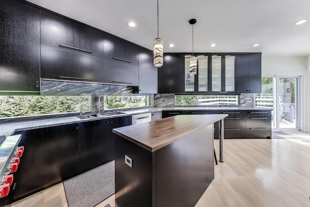 870 Woodbine Rd, Highland Park, IL 60035 - kitchen with a sink, butcher block counters, recessed lighting, tasteful backsplash, and dark cabinets