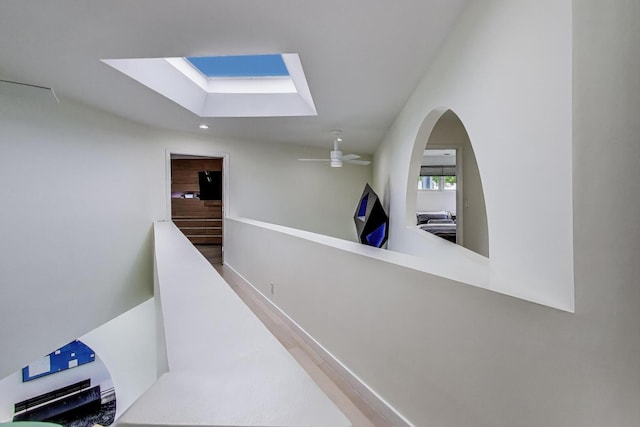 870 Woodbine Rd, Highland Park, IL 60035 - corridor featuring a skylight, recessed lighting, and an upstairs landing