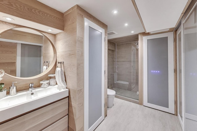 870 Woodbine Rd, Highland Park, IL 60035 - full bathroom featuring toilet, wood finished floors, a stall shower, vanity, and recessed lighting