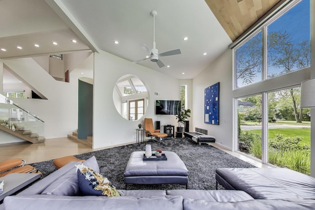 870 Woodbine Rd, Highland Park, IL 60035 - living area with high vaulted ceiling, recessed lighting, wood finished floors, stairway, and ceiling fan