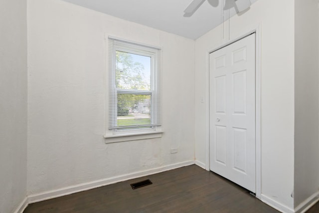3737 Rose Manor Ter, Markham, IL 60428 - unfurnished bedroom with dark wood-style flooring, baseboards, and a ceiling fan