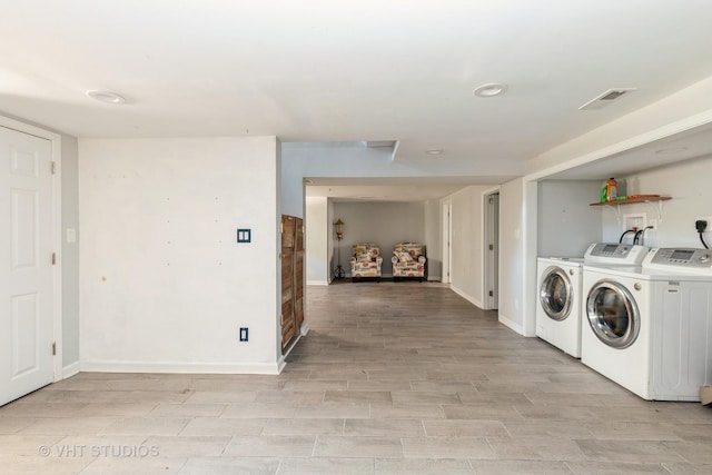 1826 Ohio Pkwy, Rockford, IL 61108 - laundry area with independent washer and dryer, light wood-type flooring, and recessed lighting