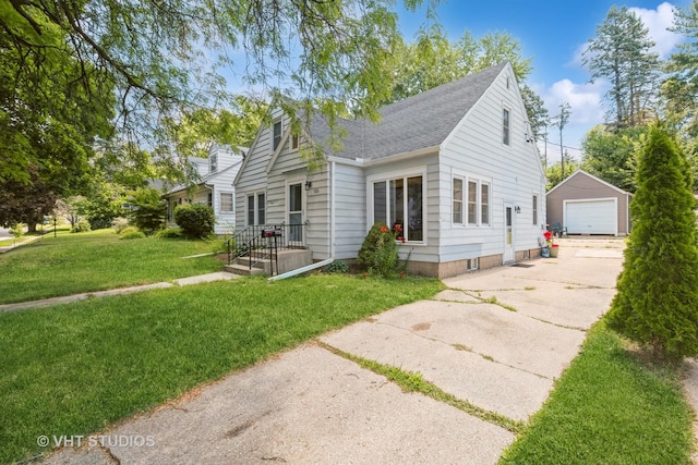 1826 Ohio Pkwy, Rockford, IL 61108 - view of front of property featuring a garage, an outdoor structure, a front lawn, driveway, and a shingled roof