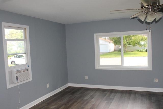 517 Victor St, Sycamore, IL 60178 - unfurnished room featuring plenty of natural light, ceiling fan, dark wood-type flooring, and baseboards