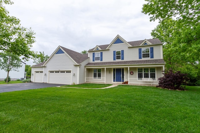 215 Hilltop Ln, Sleepy Hollow, IL 60118 - view of front facade featuring asphalt driveway, an attached garage, covered porch, and roof with shingles