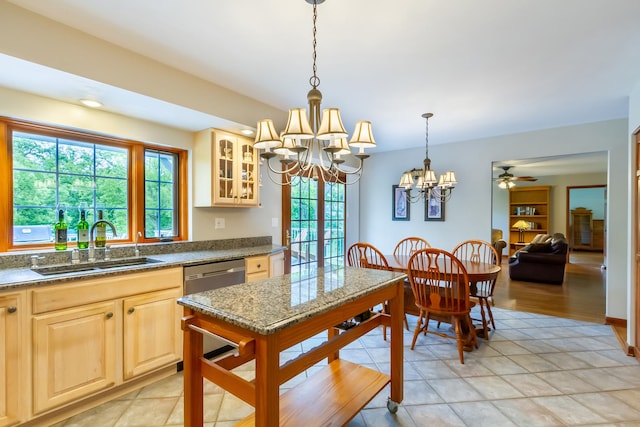 215 Hilltop Ln, Sleepy Hollow, IL 60118 - kitchen featuring light brown cabinets, a chandelier, a sink, glass insert cabinets, and pendant lighting