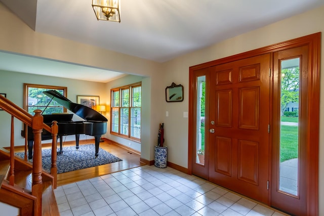 215 Hilltop Ln, Sleepy Hollow, IL 60118 - entrance foyer with plenty of natural light, light tile patterned floors, stairs, and baseboards