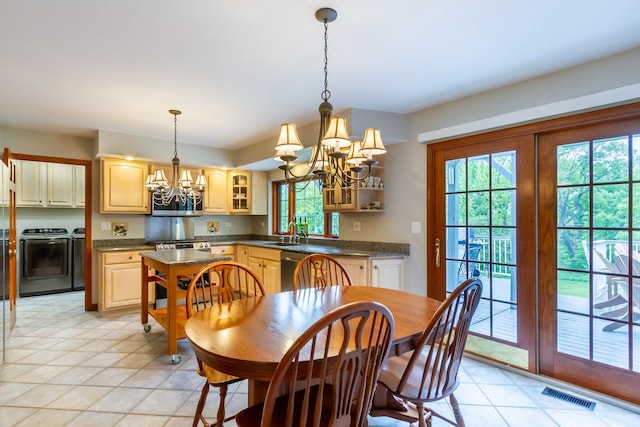 215 Hilltop Ln, Sleepy Hollow, IL 60118 - dining room featuring a chandelier, washer and clothes dryer, plenty of natural light, and french doors