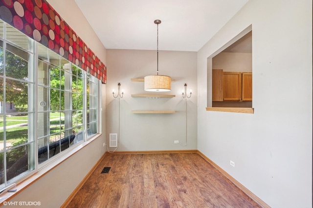 2258 Reflections Dr Unit 2258, Aurora, IL 60502 - unfurnished dining area with wood finished floors and baseboards