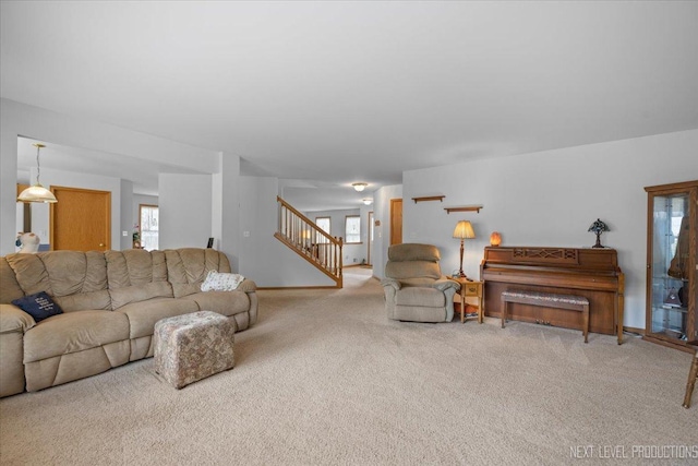 1705 Heatherstone Ave, Montgomery, IL 60538 - carpeted living room with stairway and healthy amount of natural light