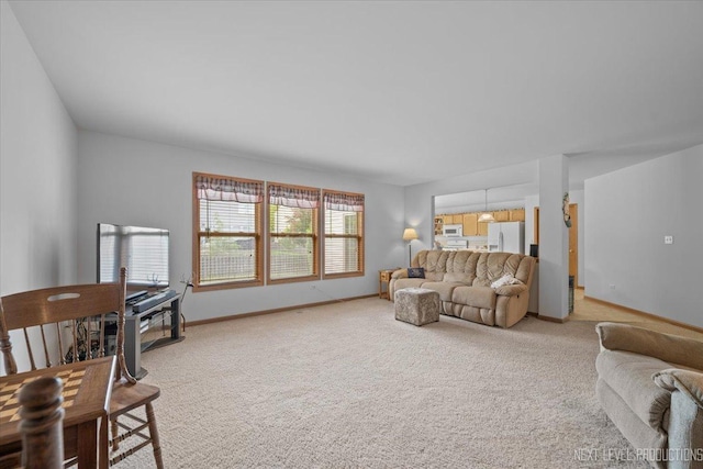 1705 Heatherstone Ave, Montgomery, IL 60538 - living room with light colored carpet and baseboards