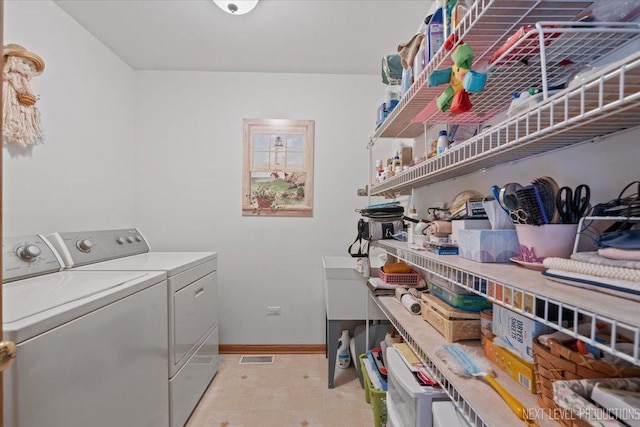 1705 Heatherstone Ave, Montgomery, IL 60538 - laundry room featuring independent washer and dryer and baseboards