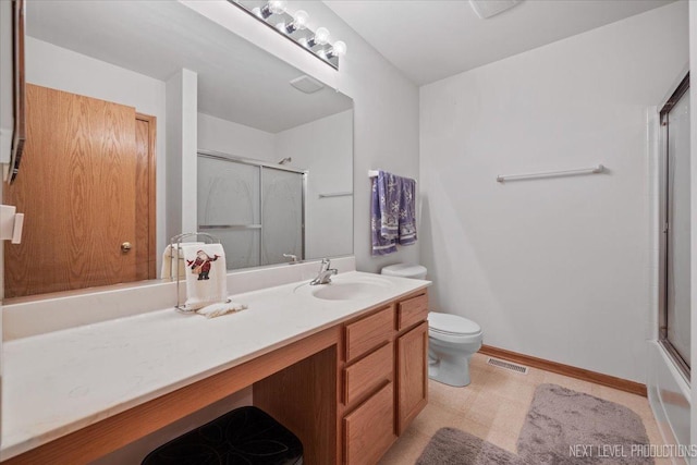 1705 Heatherstone Ave, Montgomery, IL 60538 - bathroom with an enclosed shower, vanity, toilet, tile patterned floors, and baseboards