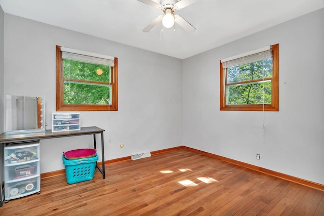 207 Redwood Ave, New Lenox, IL 60451 - unfurnished office with healthy amount of natural light, hardwood / wood-style floors, baseboards, and a ceiling fan