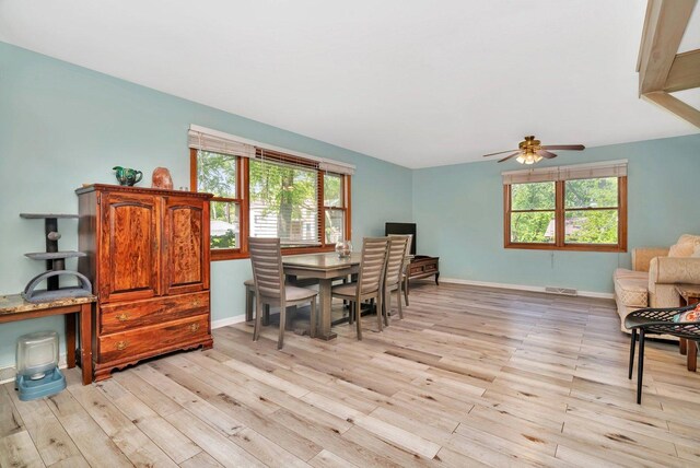 207 Redwood Ave, New Lenox, IL 60451 - dining area featuring light wood finished floors, ceiling fan, and baseboards