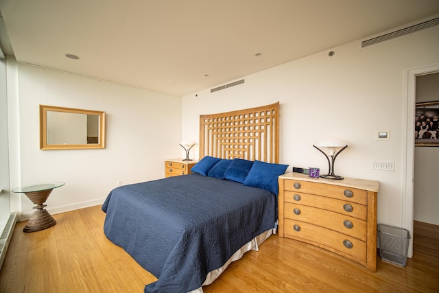 340 E Randolph St Unit 4703, Chicago, IL 60601 - bedroom featuring wood finished floors and baseboards