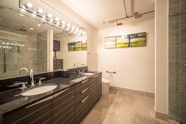 340 E Randolph St Unit 4703, Chicago, IL 60601 - full bathroom featuring a shower stall, double vanity, baseboards, and toilet