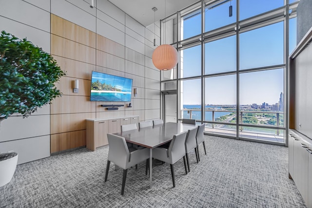 340 E Randolph St Unit 4703, Chicago, IL 60601 - dining room featuring a high ceiling, light carpet, and floor to ceiling windows