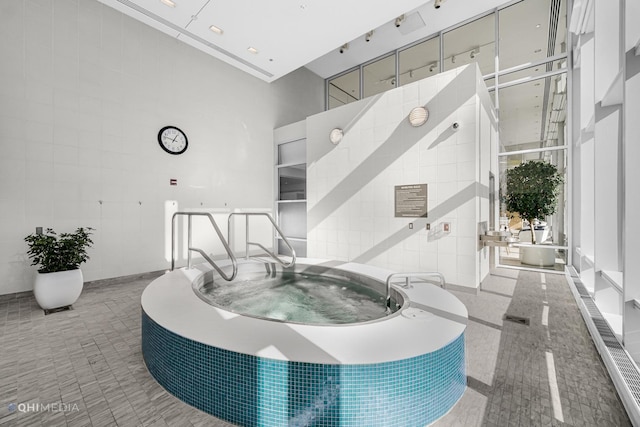 340 E Randolph St Unit 4703, Chicago, IL 60601 - common area featuring a high ceiling and tile walls