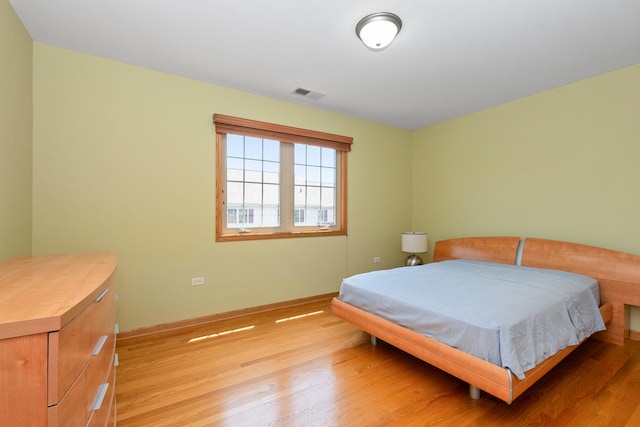 9403 Saratoga Ct, Hickory Hills, IL 60457 - bedroom with light wood finished floors and baseboards