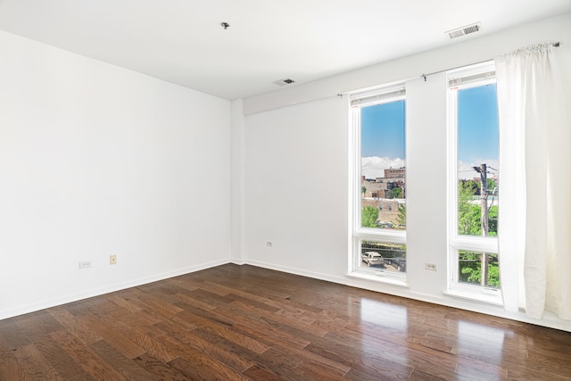 3450 S Halsted St Unit 308, Chicago, IL 60608 - unfurnished room featuring dark wood-style floors and baseboards