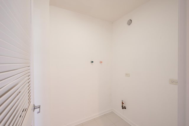 3450 S Halsted St Unit 308, Chicago, IL 60608 - laundry room featuring baseboards and light tile patterned floors