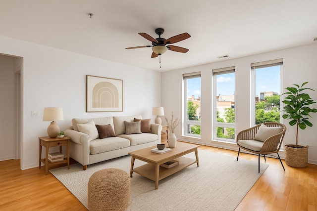 3450 S Halsted St Unit 308, Chicago, IL 60608 - living room with light wood-type flooring, ceiling fan, and baseboards