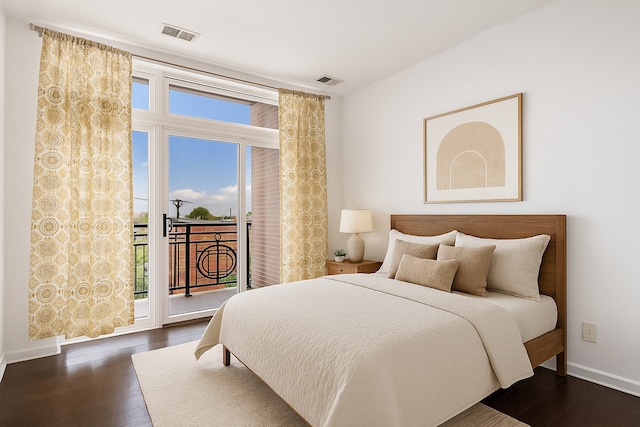 3450 S Halsted St Unit 308, Chicago, IL 60608 - bedroom featuring access to outside, dark wood-style floors, and baseboards
