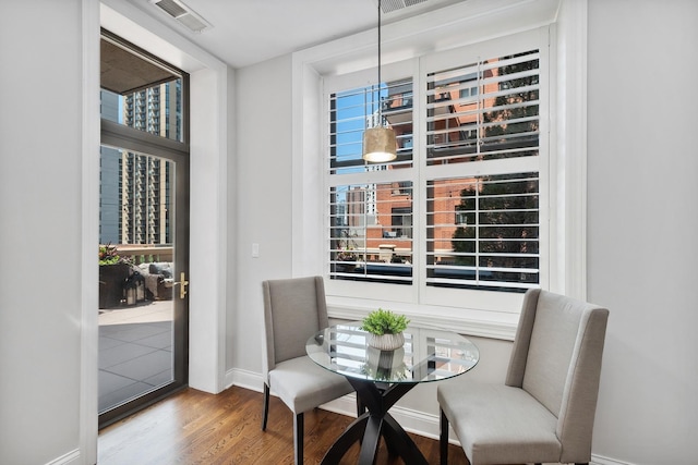 30 W Erie St Unit 402, Chicago, IL 60654 - dining space featuring wood finished floors and baseboards