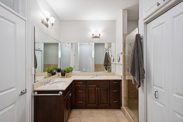 30 W Erie St Unit 402, Chicago, IL 60654 - bathroom with double vanity, a tile shower, and tile patterned flooring