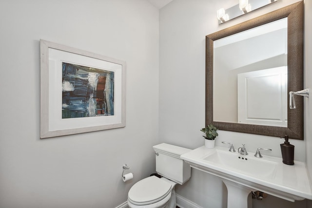 30 W Erie St Unit 402, Chicago, IL 60654 - bathroom featuring toilet and baseboards