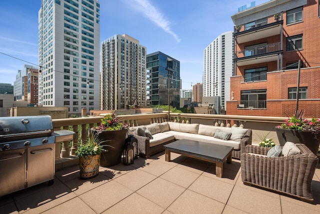 30 W Erie St Unit 402, Chicago, IL 60654 - view of patio with a city view, an outdoor hangout area, and grilling area