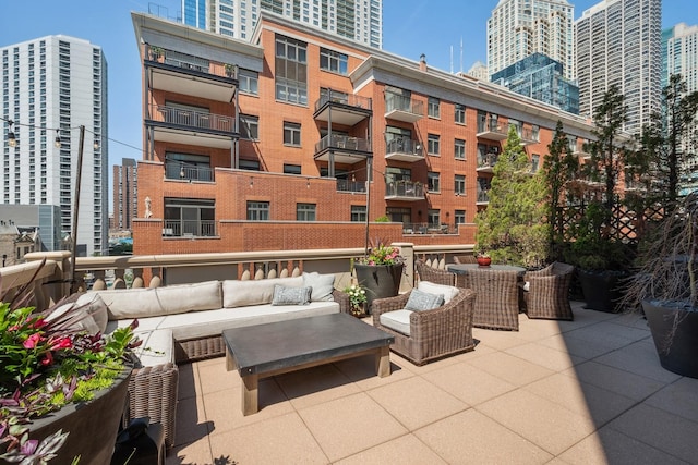 30 W Erie St Unit 402, Chicago, IL 60654 - view of patio / terrace featuring outdoor lounge area and a city view