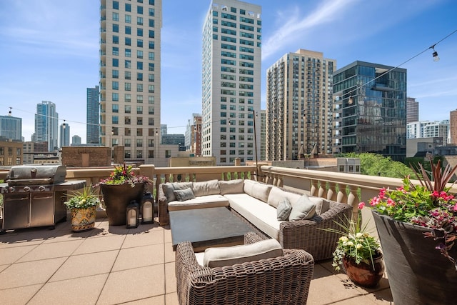 30 W Erie St Unit 402, Chicago, IL 60654 - view of patio featuring a skyline view, outdoor lounge area, and a grill