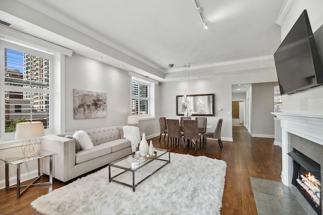 30 W Erie St Unit 402, Chicago, IL 60654 - living area featuring dark wood-type flooring, a fireplace with flush hearth, ornamental molding, baseboards, and recessed lighting