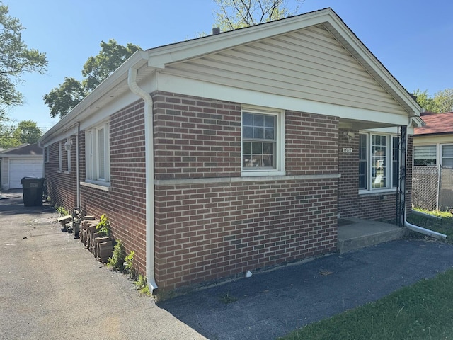14812 S Wabash Ave, Dolton, IL 60419 - view of side of home featuring brick siding and a garage