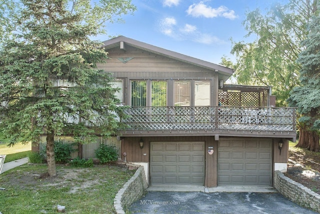 6542 S Ridge Rd, Willowbrook, IL 60527 - view of front of property featuring an attached garage and asphalt driveway