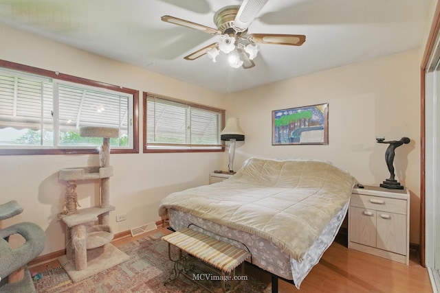 6542 S Ridge Rd, Willowbrook, IL 60527 - bedroom with light wood-style flooring and ceiling fan