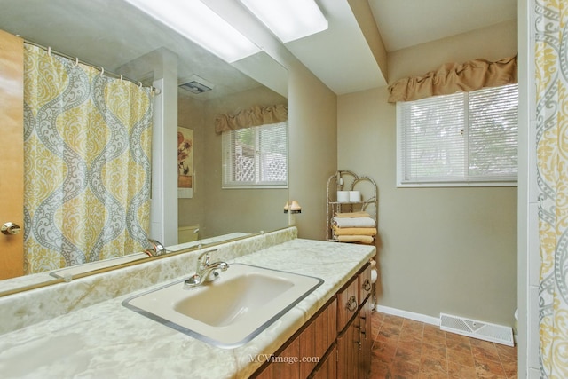 6542 S Ridge Rd, Willowbrook, IL 60527 - bathroom with toilet, baseboards, vanity, and a shower with shower curtain
