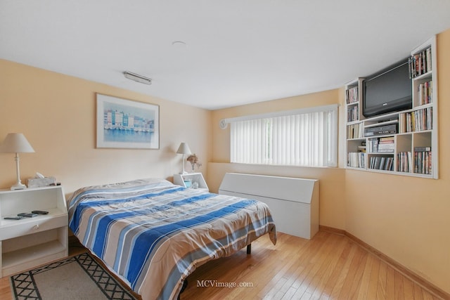 6542 S Ridge Rd, Willowbrook, IL 60527 - bedroom with hardwood / wood-style flooring and baseboards