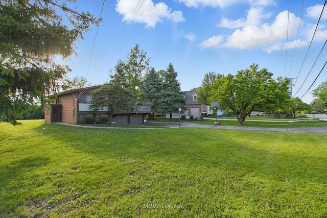 6542 S Ridge Rd, Willowbrook, IL 60527 - view of green lawn featuring asphalt driveway