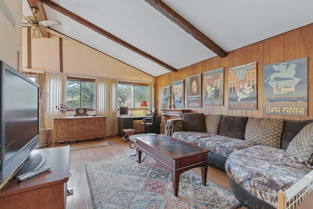 6542 S Ridge Rd, Willowbrook, IL 60527 - living room with beamed ceiling, a desk, wooden walls, light wood-type flooring, and ceiling fan
