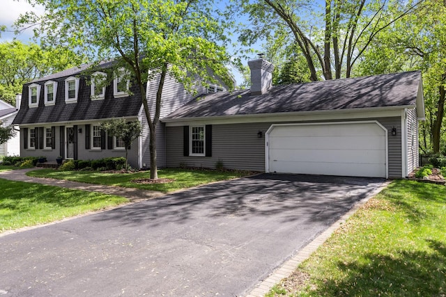 25W303 Gunston Ave, Naperville, IL 60540 - view of front of property with driveway, a chimney, a shingled roof, and an attached garage