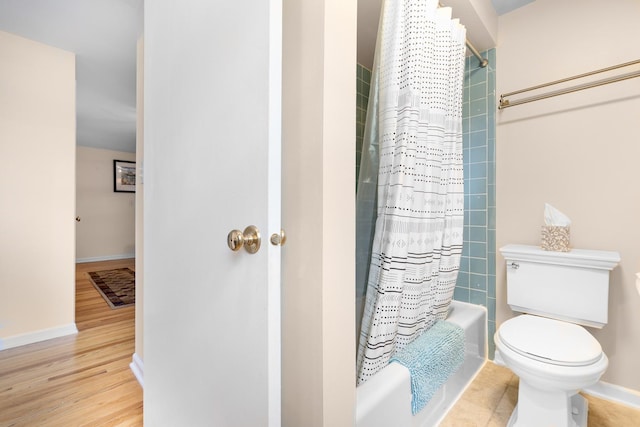25W303 Gunston Ave, Naperville, IL 60540 - full bath featuring shower / bathtub combination with curtain, baseboards, toilet, and wood finished floors