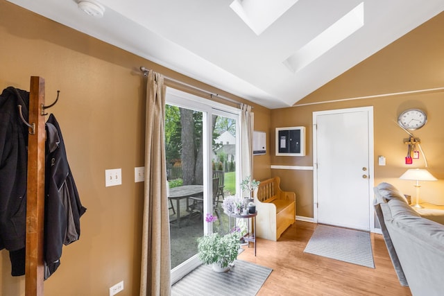 25W303 Gunston Ave, Naperville, IL 60540 - entryway featuring a skylight, wood finished floors, vaulted ceiling, and baseboards